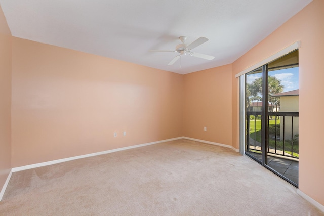 empty room featuring light carpet, ceiling fan, and baseboards