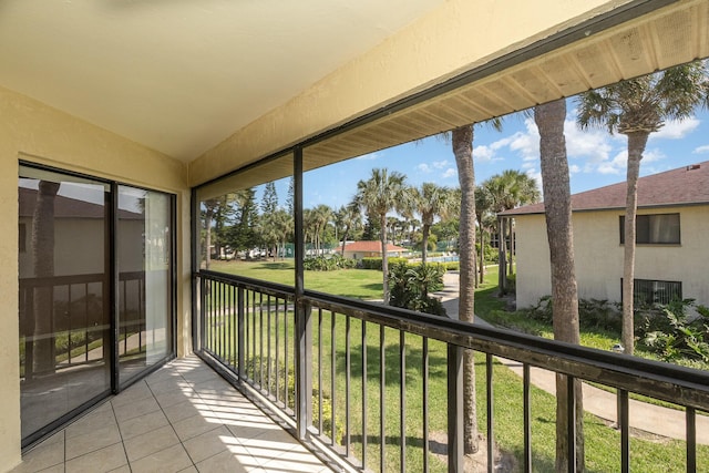 unfurnished sunroom with vaulted ceiling