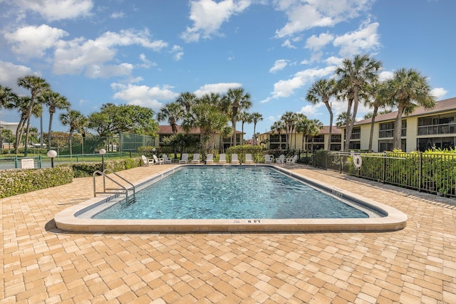 community pool featuring fence