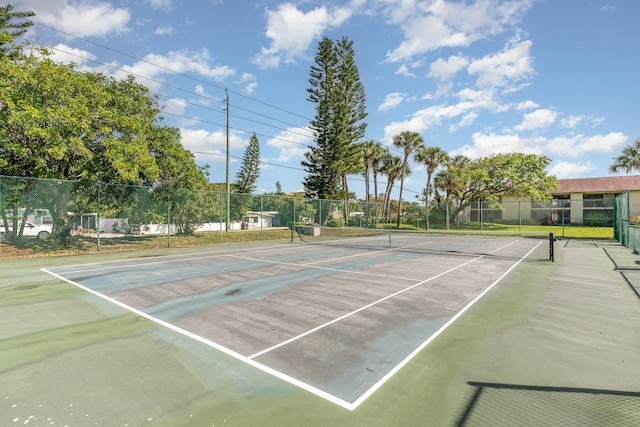 view of sport court with fence