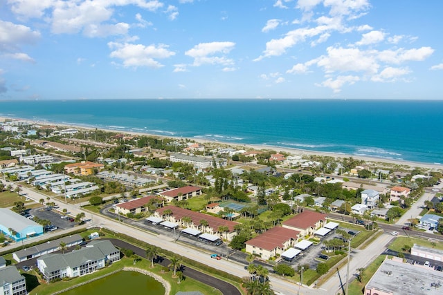 bird's eye view featuring a water view, a residential view, and a view of the beach