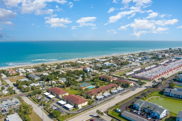 drone / aerial view with a water view and a view of the beach