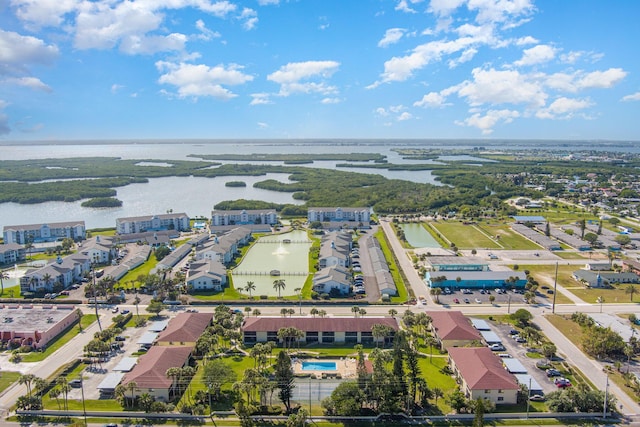 birds eye view of property with a residential view and a water view