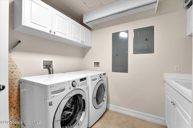 clothes washing area with electric panel, cabinet space, baseboards, and separate washer and dryer