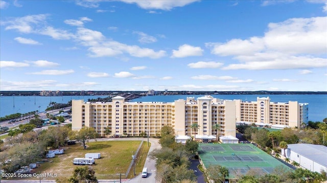 birds eye view of property with a water view
