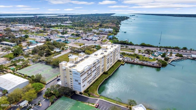 birds eye view of property with a water view