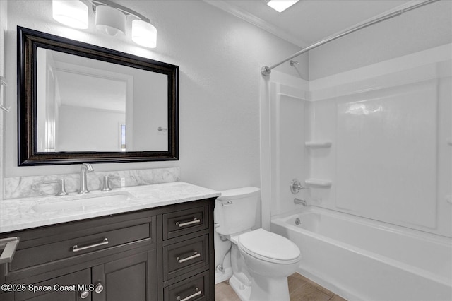 full bath with shower / bathtub combination, vanity, toilet, and crown molding