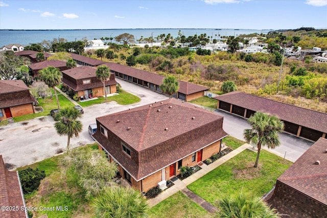 birds eye view of property featuring a water view