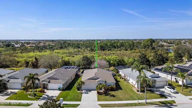 bird's eye view with a residential view and a wooded view