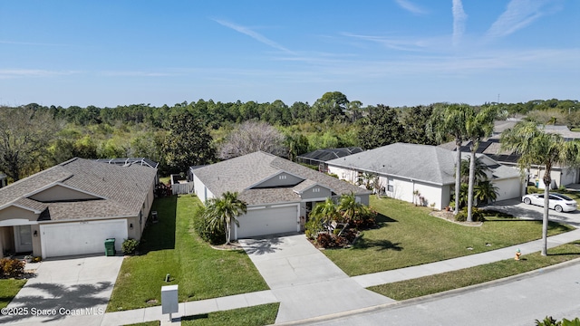 bird's eye view with a forest view and a residential view