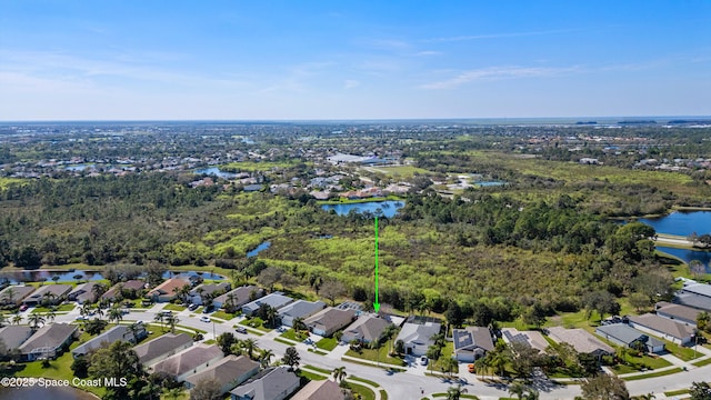 bird's eye view featuring a water view and a residential view