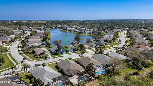 bird's eye view featuring a residential view and a water view