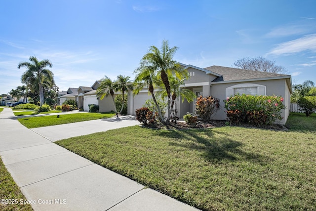 view of front facade featuring driveway, an attached garage, a front lawn, and stucco siding