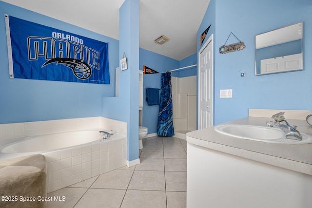 full bathroom with tiled bath, toilet, curtained shower, tile patterned flooring, and vanity