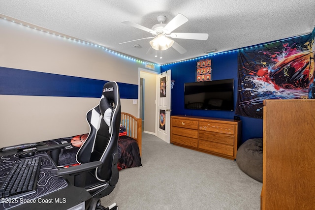 office space featuring ceiling fan, a textured ceiling, and carpet flooring