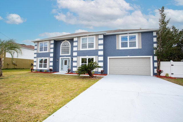 view of front of house with stucco siding, concrete driveway, fence, a garage, and a front lawn