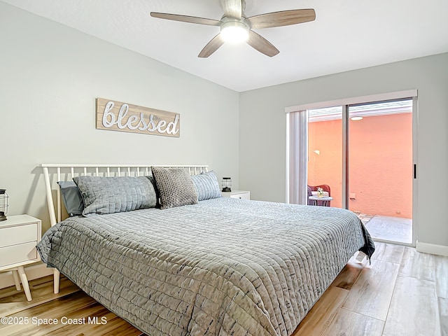 bedroom with ceiling fan, baseboards, wood finished floors, and access to exterior