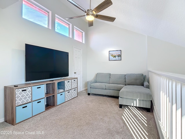 carpeted living room featuring high vaulted ceiling, a ceiling fan, and a textured ceiling