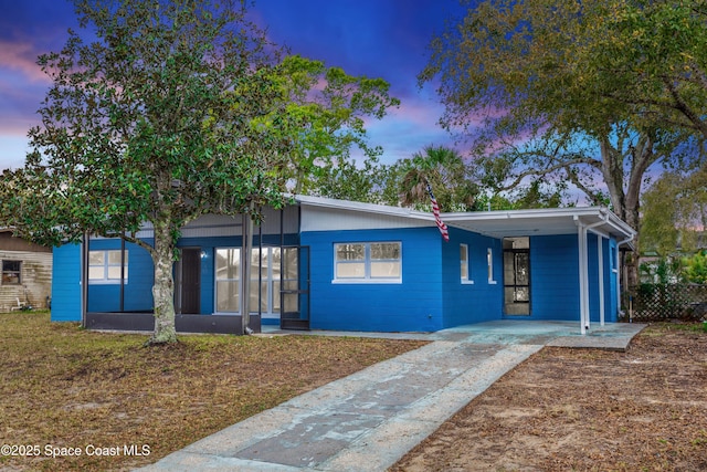 view of front of home with a carport