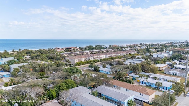 drone / aerial view featuring a water view and a residential view