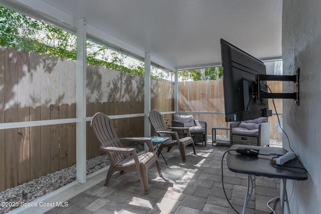 sunroom / solarium featuring a healthy amount of sunlight