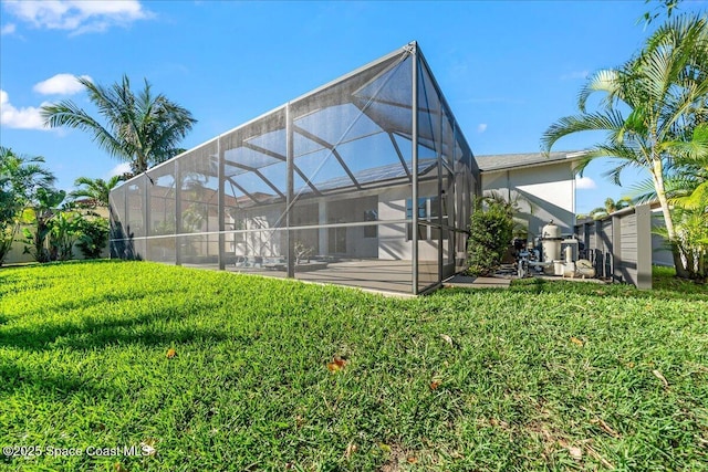 back of property featuring a yard and a lanai