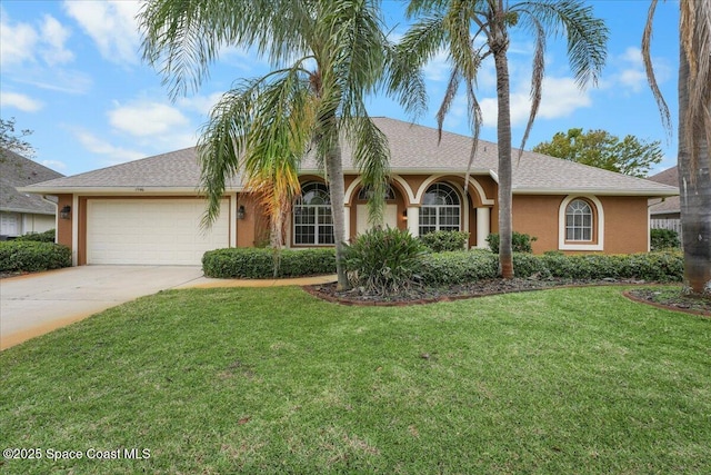 single story home with an attached garage, concrete driveway, a front yard, and stucco siding