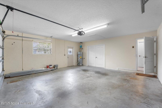 garage featuring secured water heater and a garage door opener