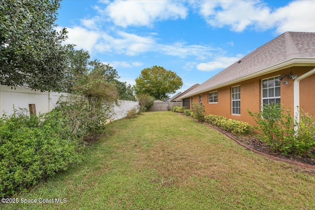 view of yard featuring a fenced backyard