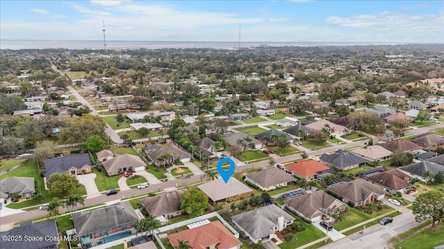 drone / aerial view featuring a water view and a residential view