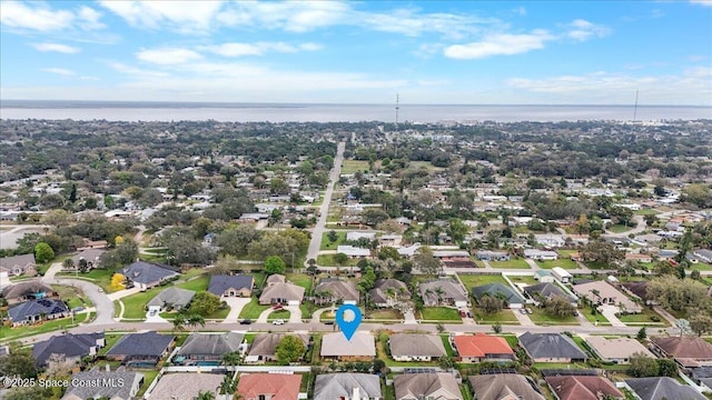 bird's eye view with a water view and a residential view