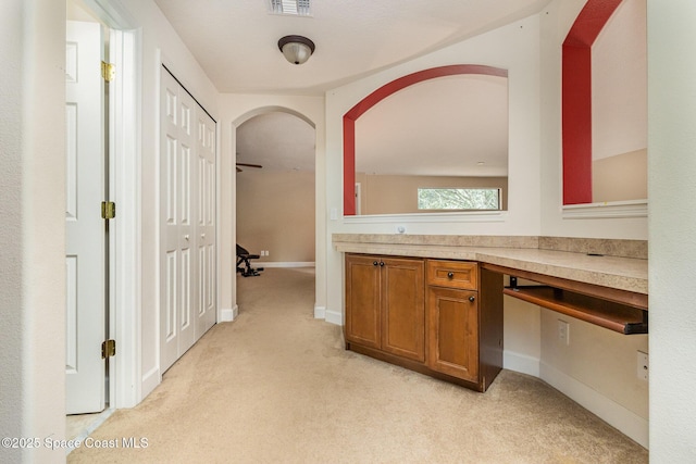 bathroom with carpet floors, baseboards, vanity, and visible vents