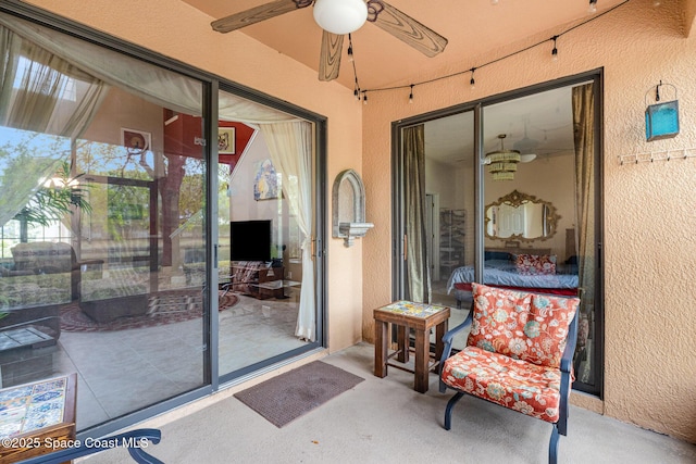 exterior space featuring a ceiling fan