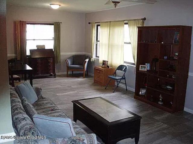 living room featuring baseboards