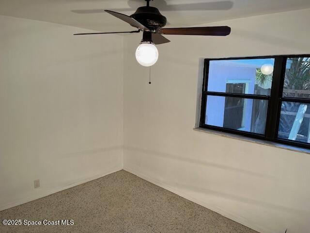 124 E Dover St E, Satellite Beach, FL 32937 - empty room featuring speckled floor and a ceiling fan