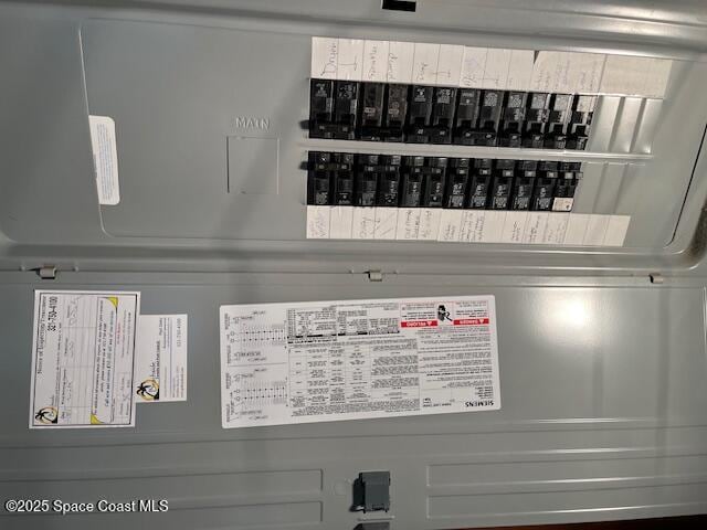 124 E Dover St E, Satellite Beach, FL 32937 - utility room featuring electric panel