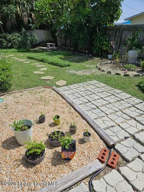 124 E Dover St E, Satellite Beach, FL 32937 - view of yard with a patio