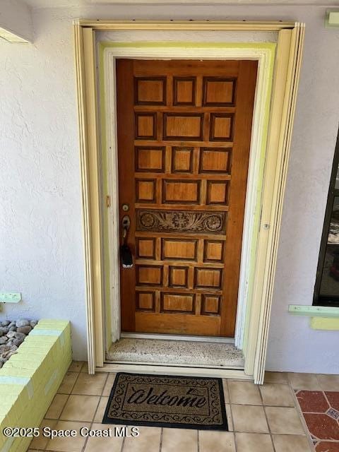 124 E Dover St E, Satellite Beach, FL 32937 - entrance to property featuring stucco siding