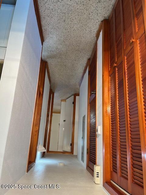 124 E Dover St E, Satellite Beach, FL 32937 - hall featuring a textured ceiling