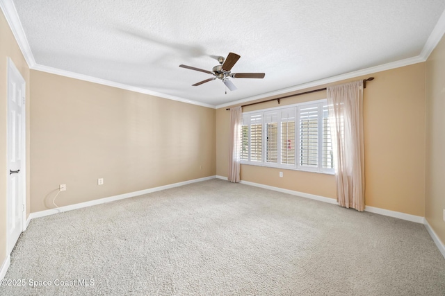 spare room featuring crown molding, a ceiling fan, carpet flooring, a textured ceiling, and baseboards