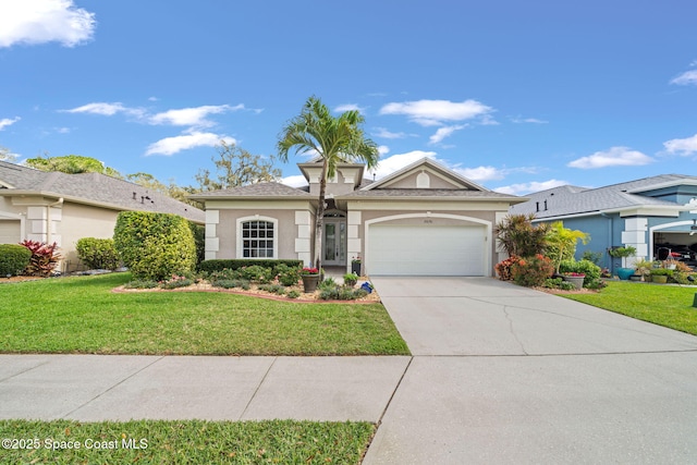 view of front of property featuring a garage, driveway, a front lawn, and stucco siding