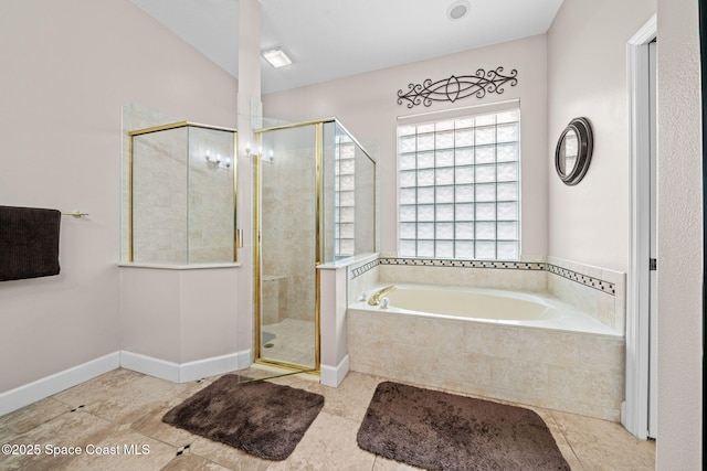 bathroom with a stall shower, tile patterned flooring, baseboards, and a bath