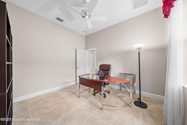 office featuring ceiling fan, visible vents, baseboards, and light tile patterned flooring