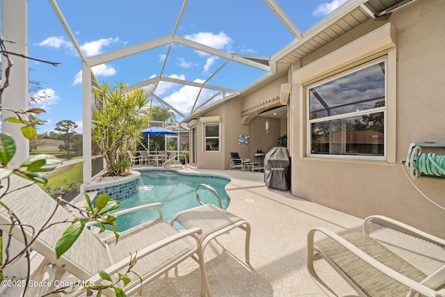 pool with a lanai and a patio area