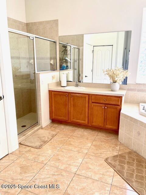 1401 Rila St SE, Palm Bay, FL 32909 - bathroom with vanity, tile patterned flooring, and a shower stall