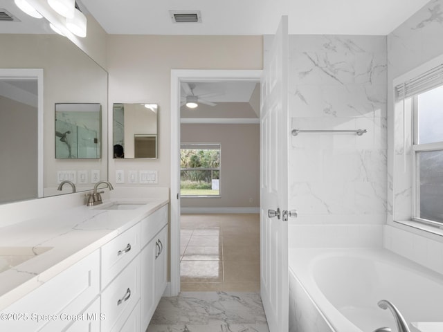 bathroom with a washtub, a sink, visible vents, marble finish floor, and double vanity