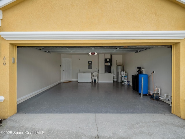 garage with washing machine and dryer, electric water heater, and electric panel