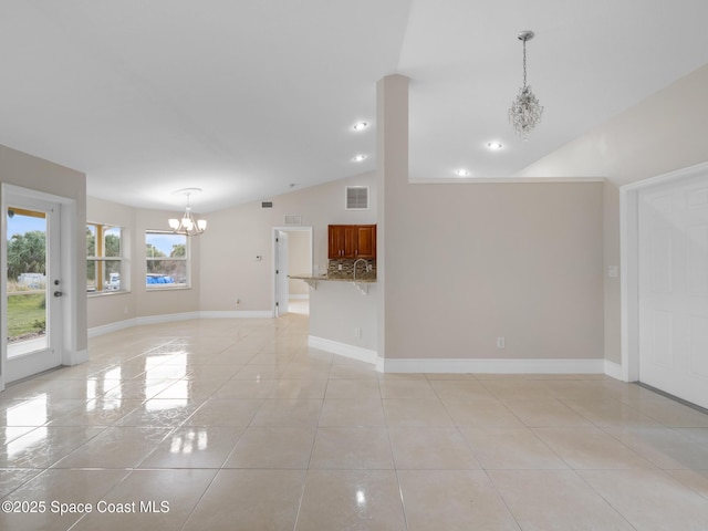 unfurnished living room with light tile patterned floors, baseboards, visible vents, and a notable chandelier