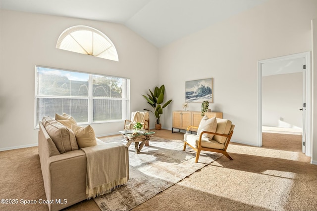 carpeted living room with vaulted ceiling and baseboards