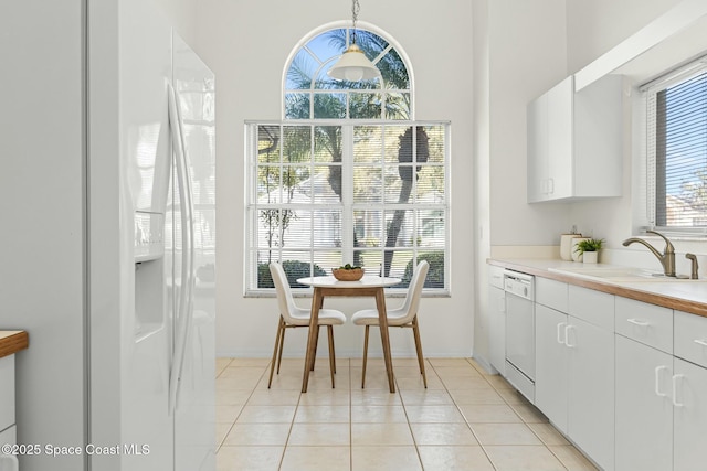 dining space with light tile patterned floors